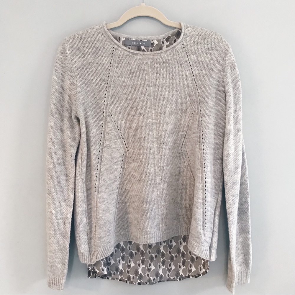 Light grey knit sweater with fabric underlay